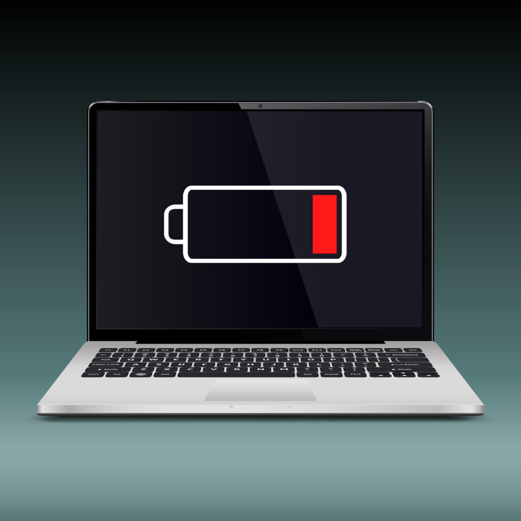 Laptop with low battery icon, indicating a potential reason why a laptop is not turning on.